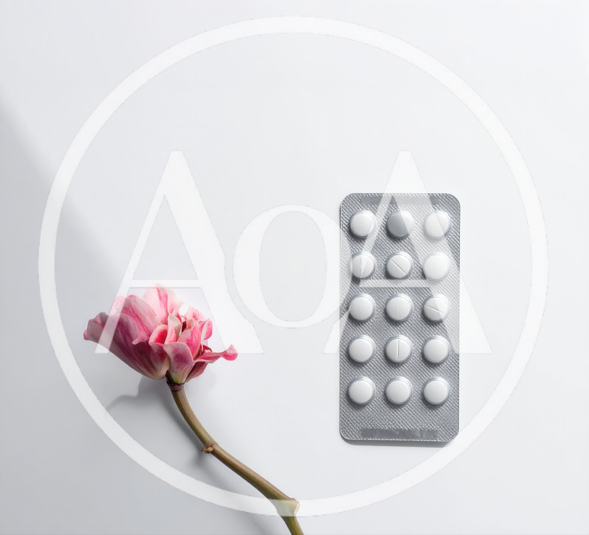 Pink Flower And Blister Pack Of White Pills