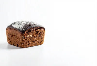 Loaf of Dark Rye Bread on White Background