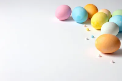 Colorful Easter Eggs Arranged On A White Background