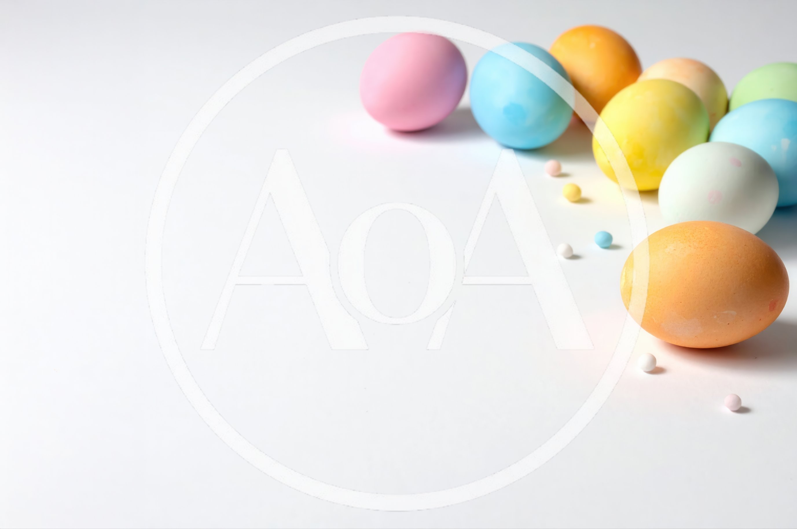 Colorful Easter Eggs Arranged On A White Background