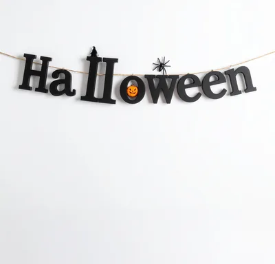 Halloween Decorative Letter Banner Hanging on White Wall
