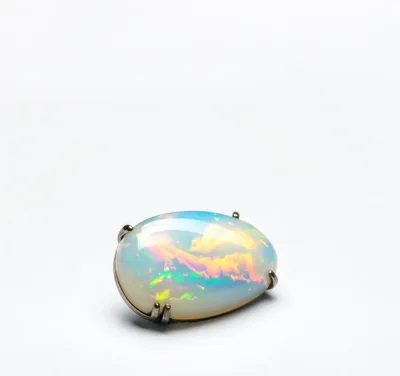 Oval Cabochon Opal Gemstone Set In Silver Setting