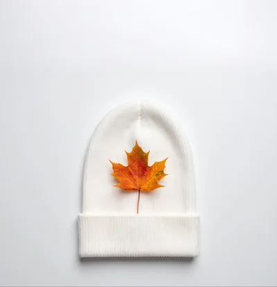 White Knit Beanie With A Single Maple Leaf