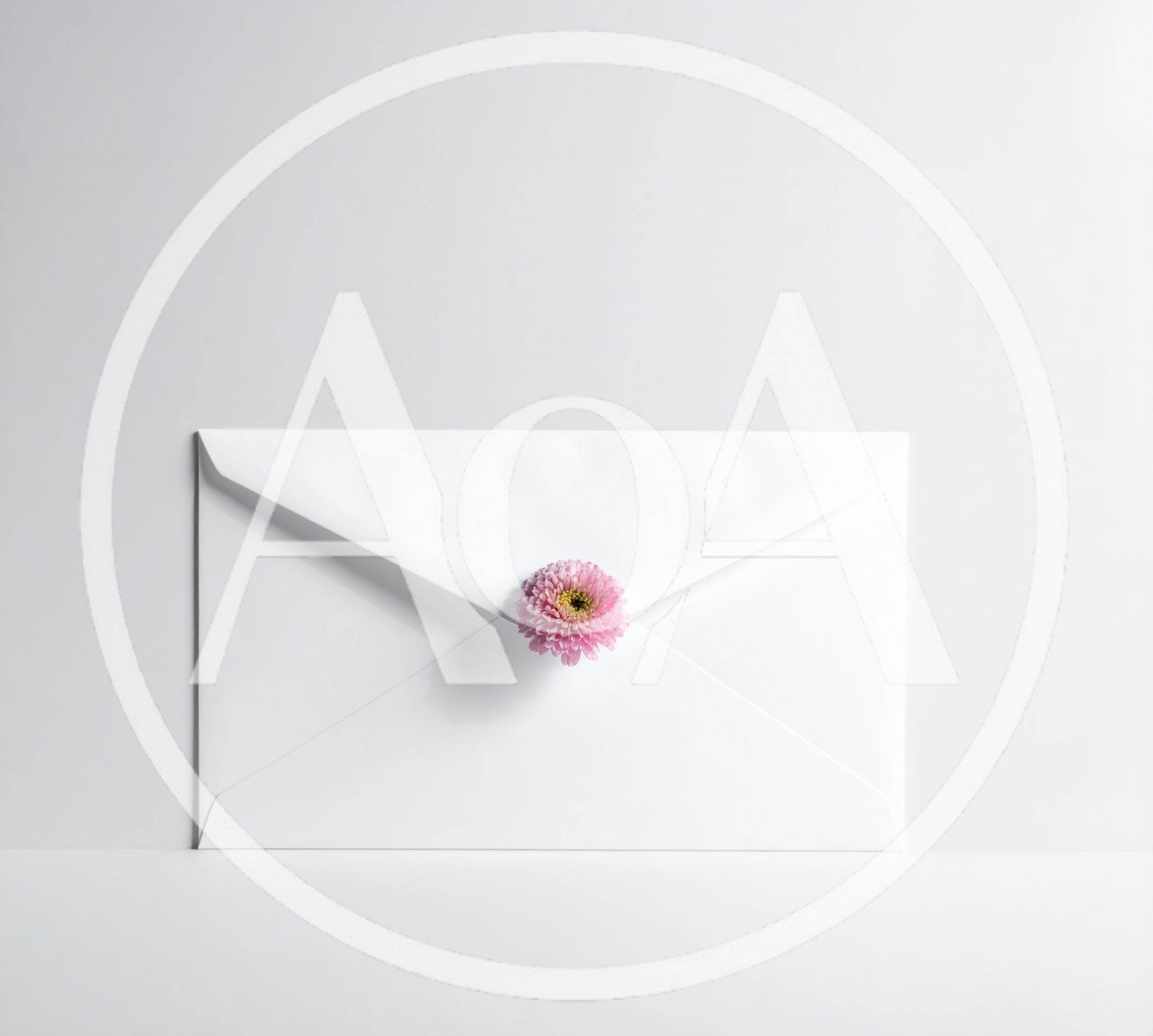 White Envelope Sealed With A Pink Flower