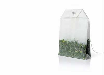 Single Tea Bag With Green Tea Leaves