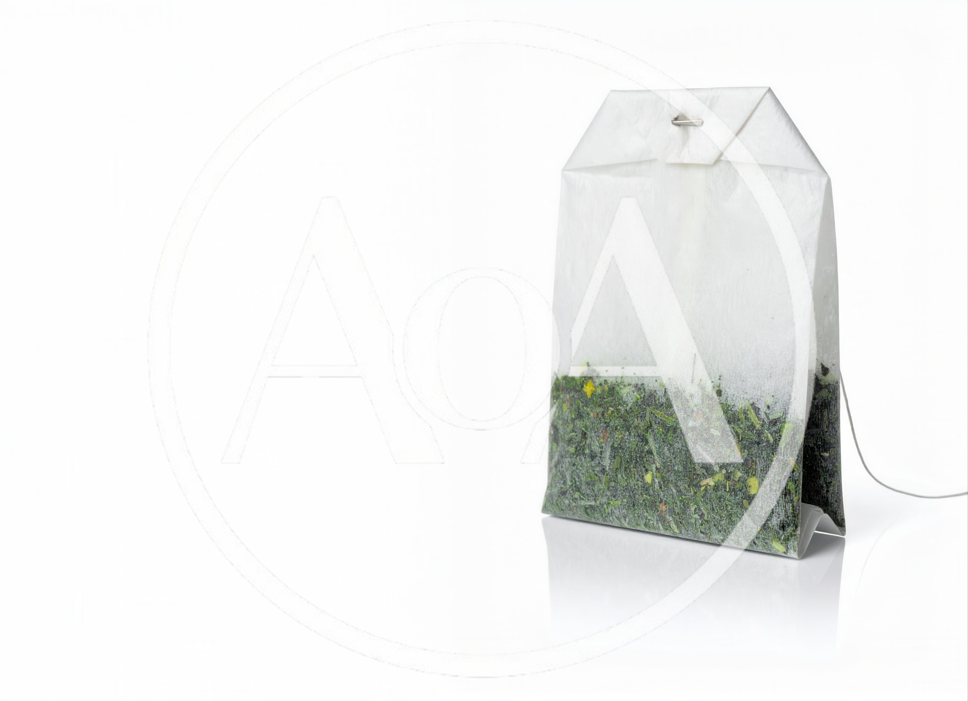 Single Tea Bag With Green Tea Leaves