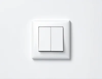 White Double Light Switch On A Plain Wall