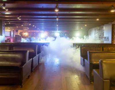 Empty Nightclub Lounge With Fog And Dim Lighting