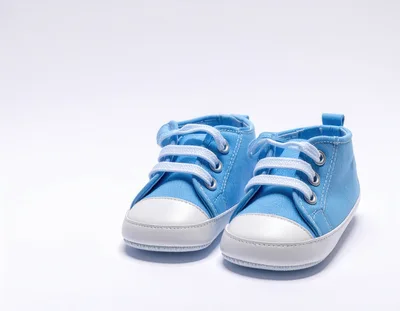 Pair Of Blue Baby Sneakers On White Background