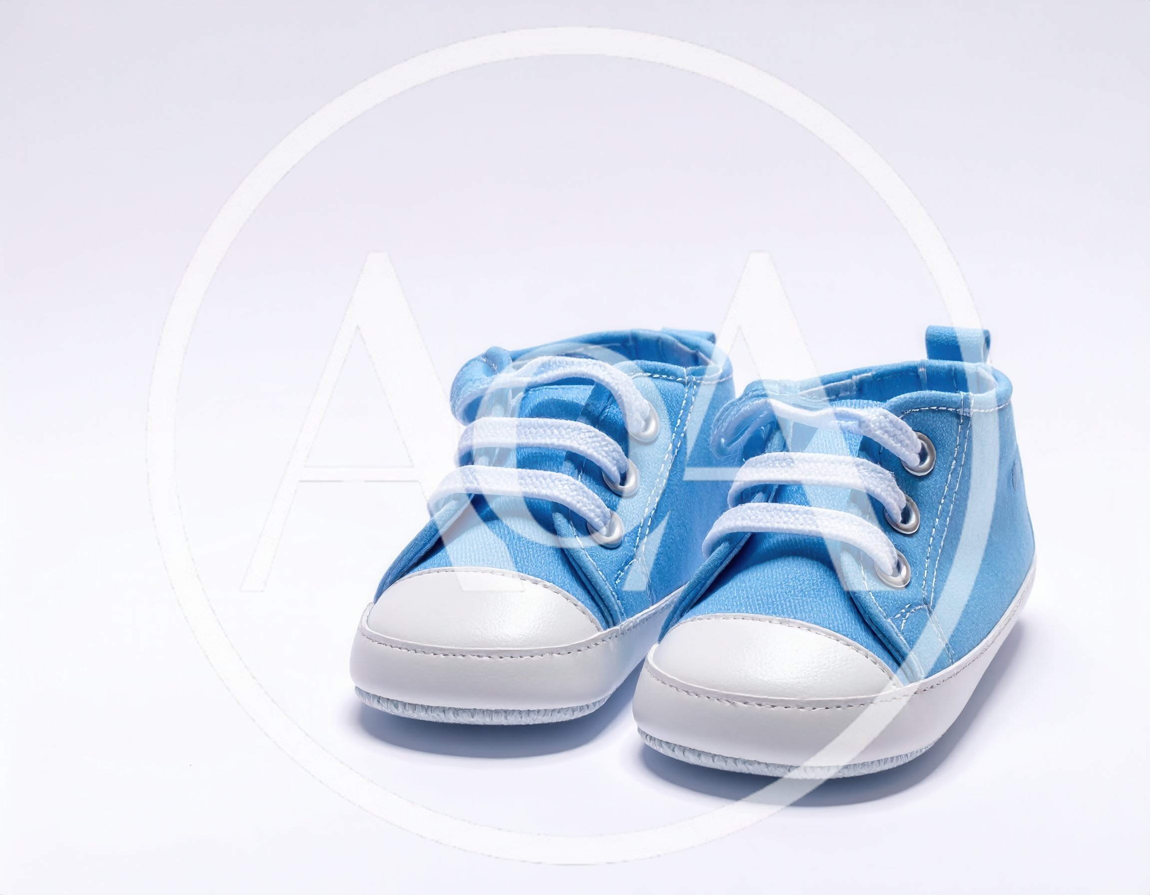Pair Of Blue Baby Sneakers On White Background