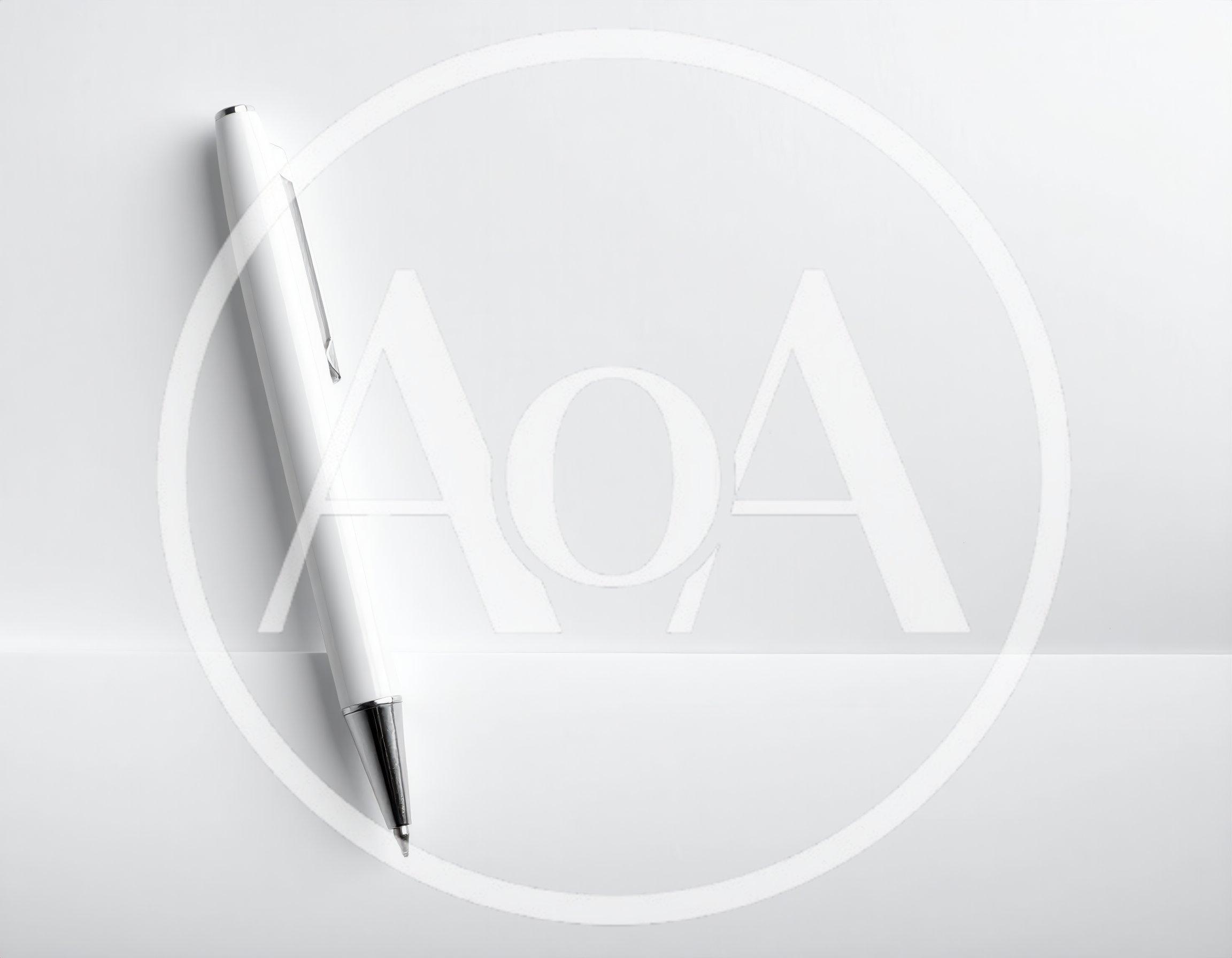 White Ballpoint Pen Resting On Blank Paper
