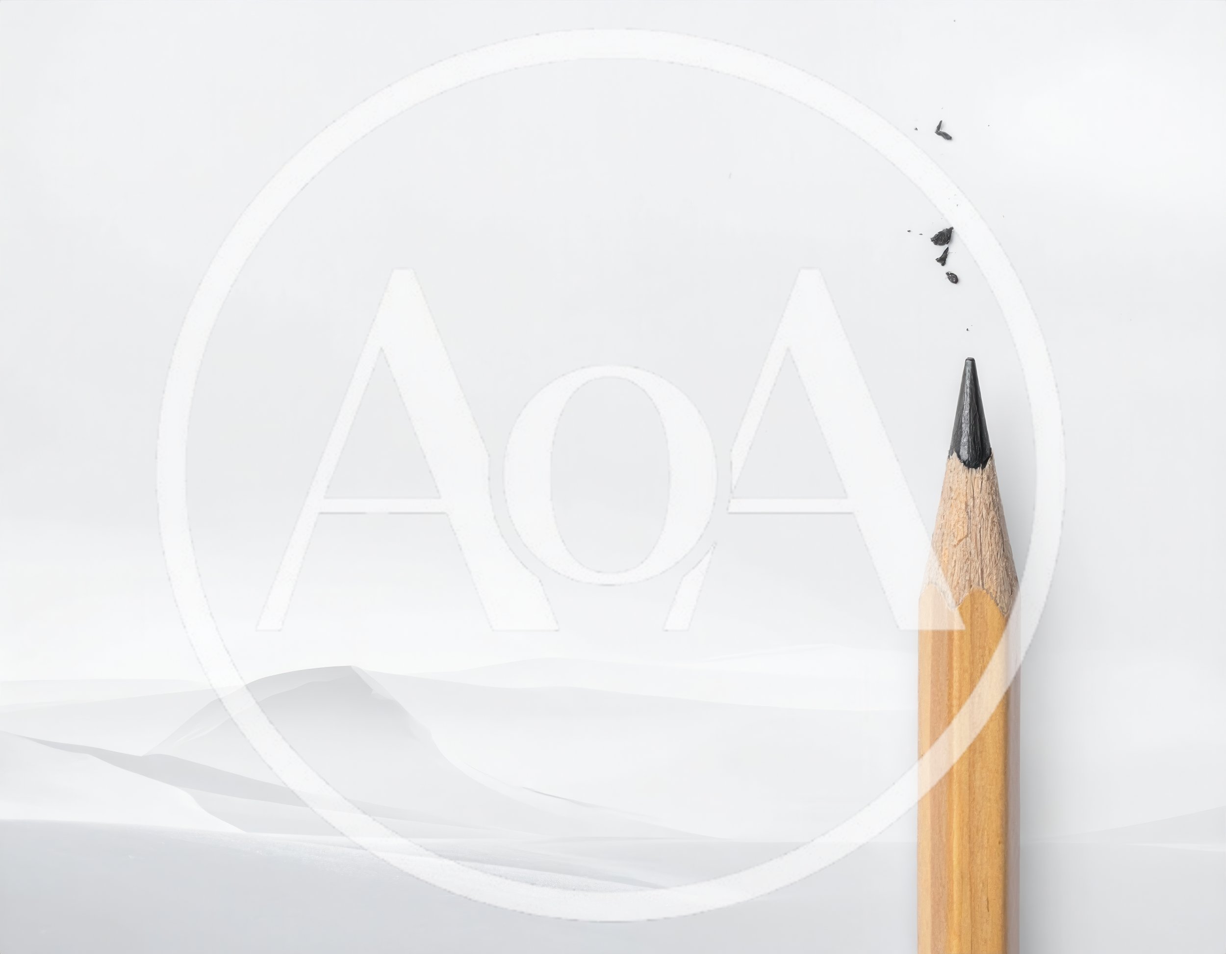 Sharpened Wooden Pencil Against White Paper Background