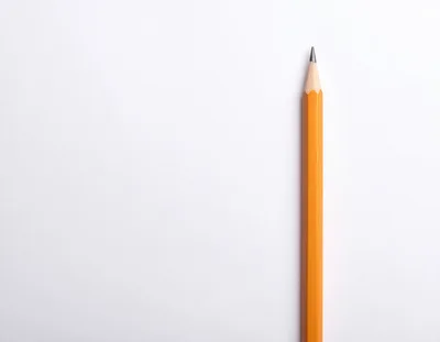 Yellow Pencil Standing Vertically On White Background