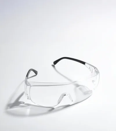 Clear Protective Safety Glasses on White Background