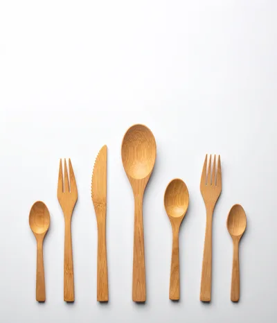 Set Of Wooden Cutlery On White Background