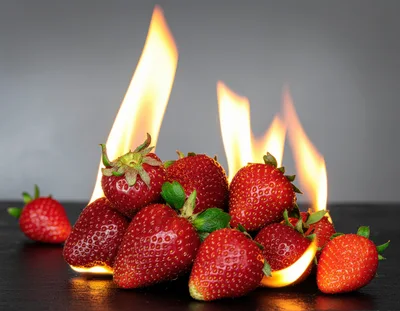 Fresh Strawberries Burning With Bright Orange Flames