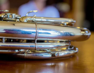 Close Up Of A Silver Tuba On A Table
