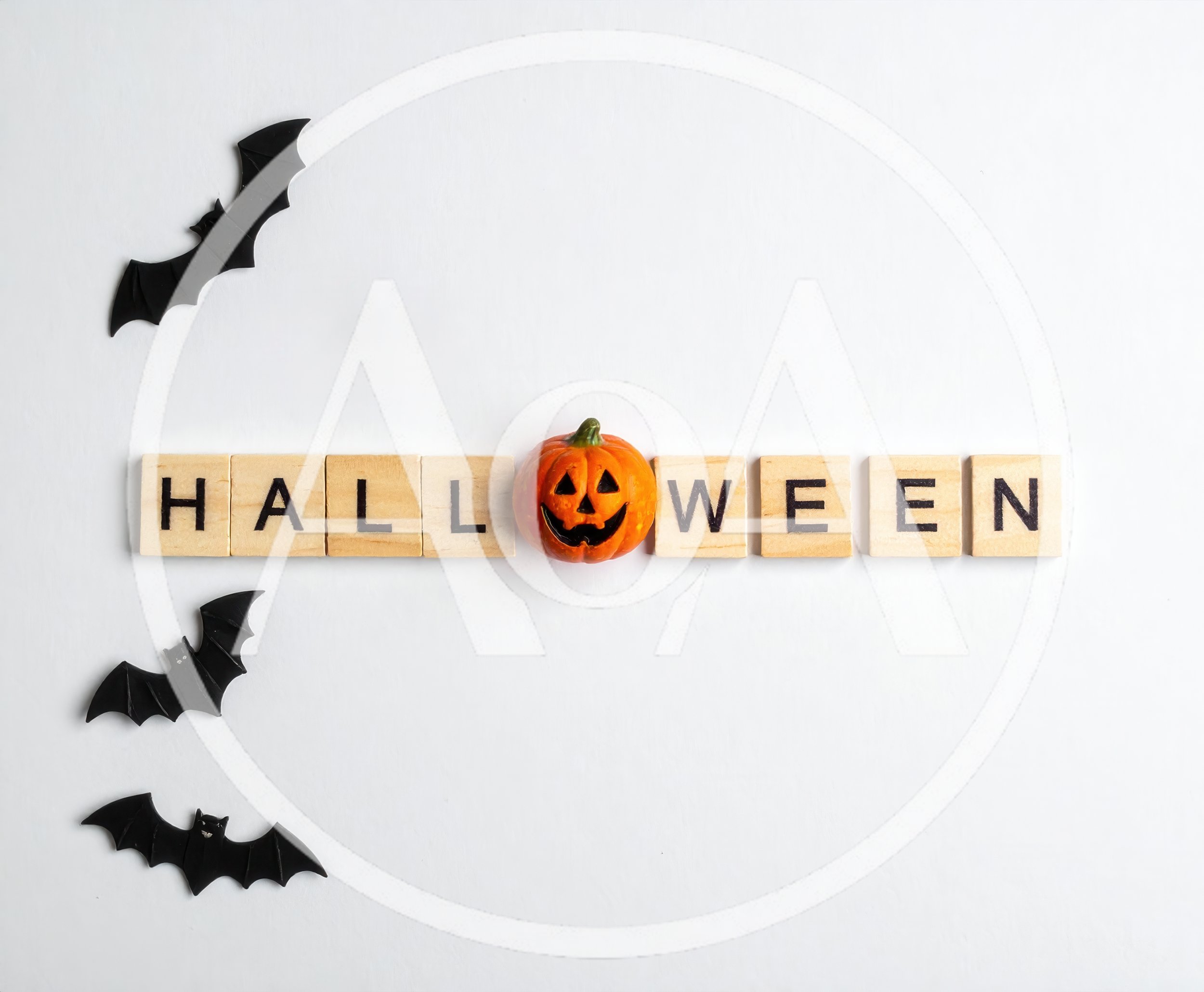 Halloween Word Spelled With Wooden Tiles And Pumpkin