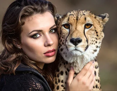 Beautiful Woman Embracing A Majestic Cheetah