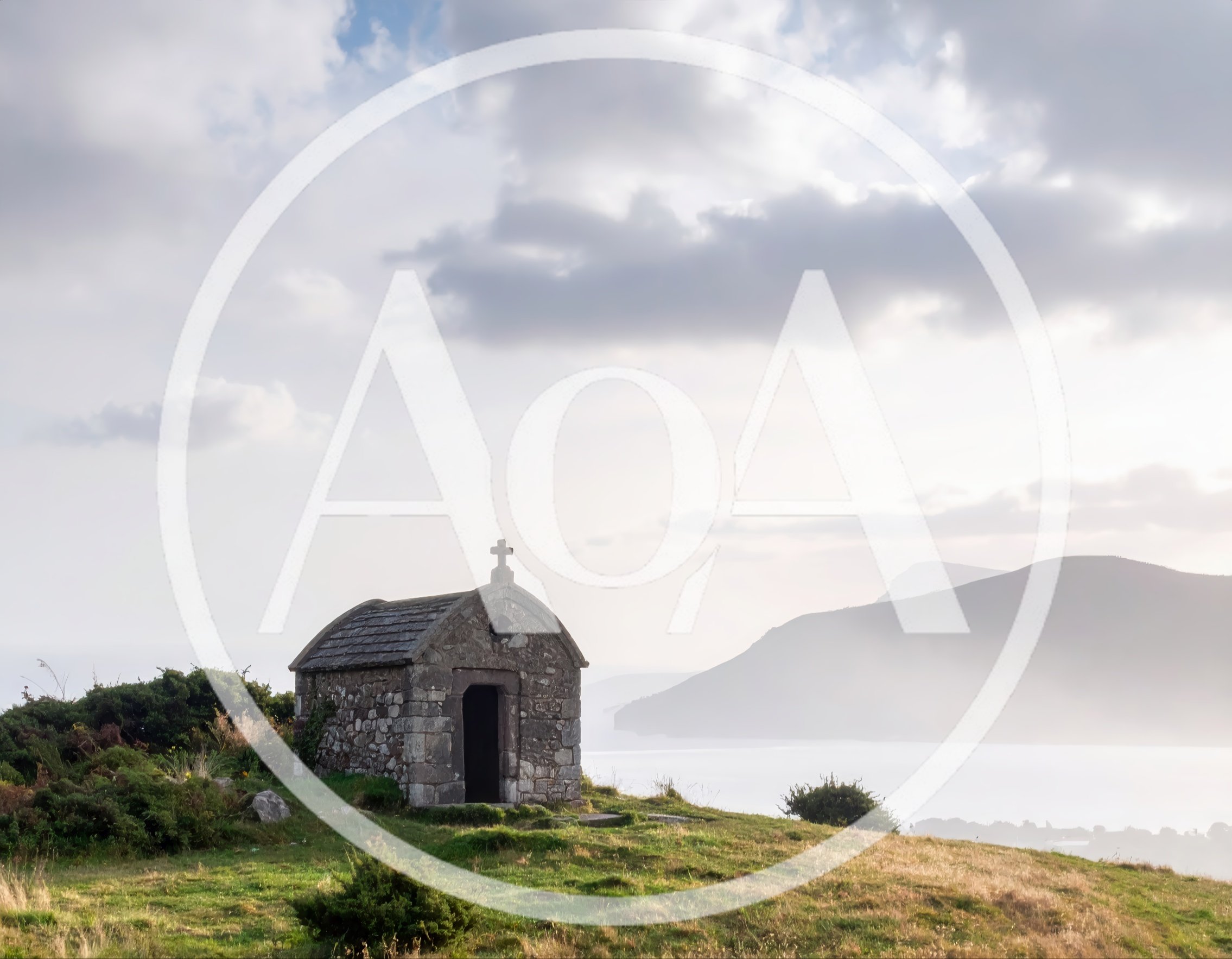 Small Stone Chapel Overlooking A Misty Coastal Landscape