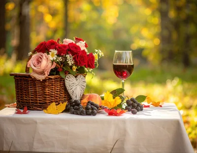 Romantic Autumn Picnic With Wine And Flowers