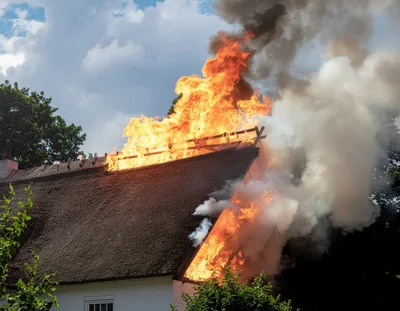 Thatched Roof House Engulfed In Intense Fire