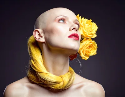 Bald Woman With Yellow Hair Accessory And Roses