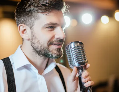 Man Singing Into A Vintage Microphone