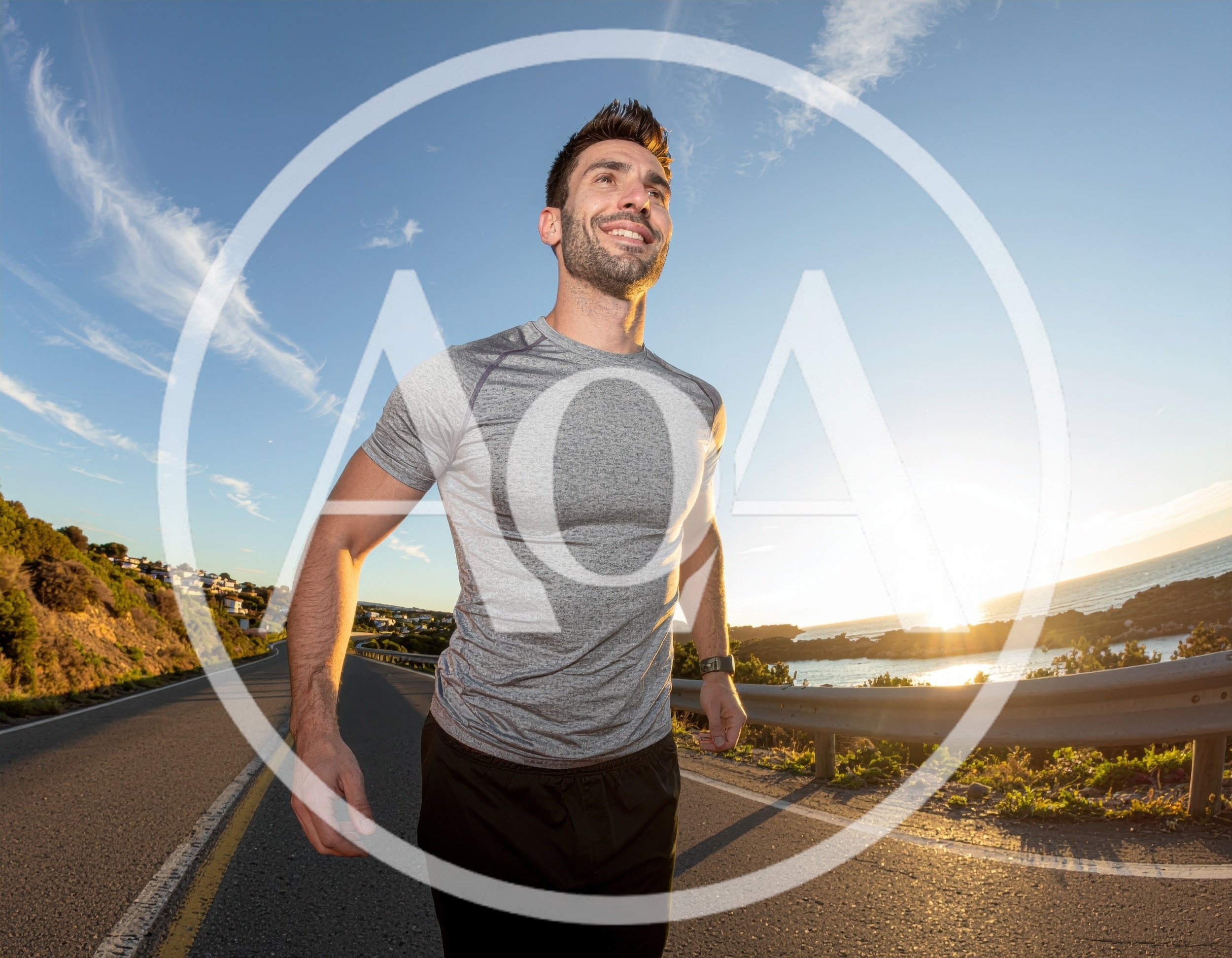 Athletic Man Running Along Coastal Road At Sunset