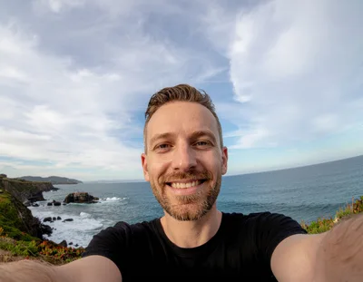 Man Taking A Selfie On A Coastal Cliff