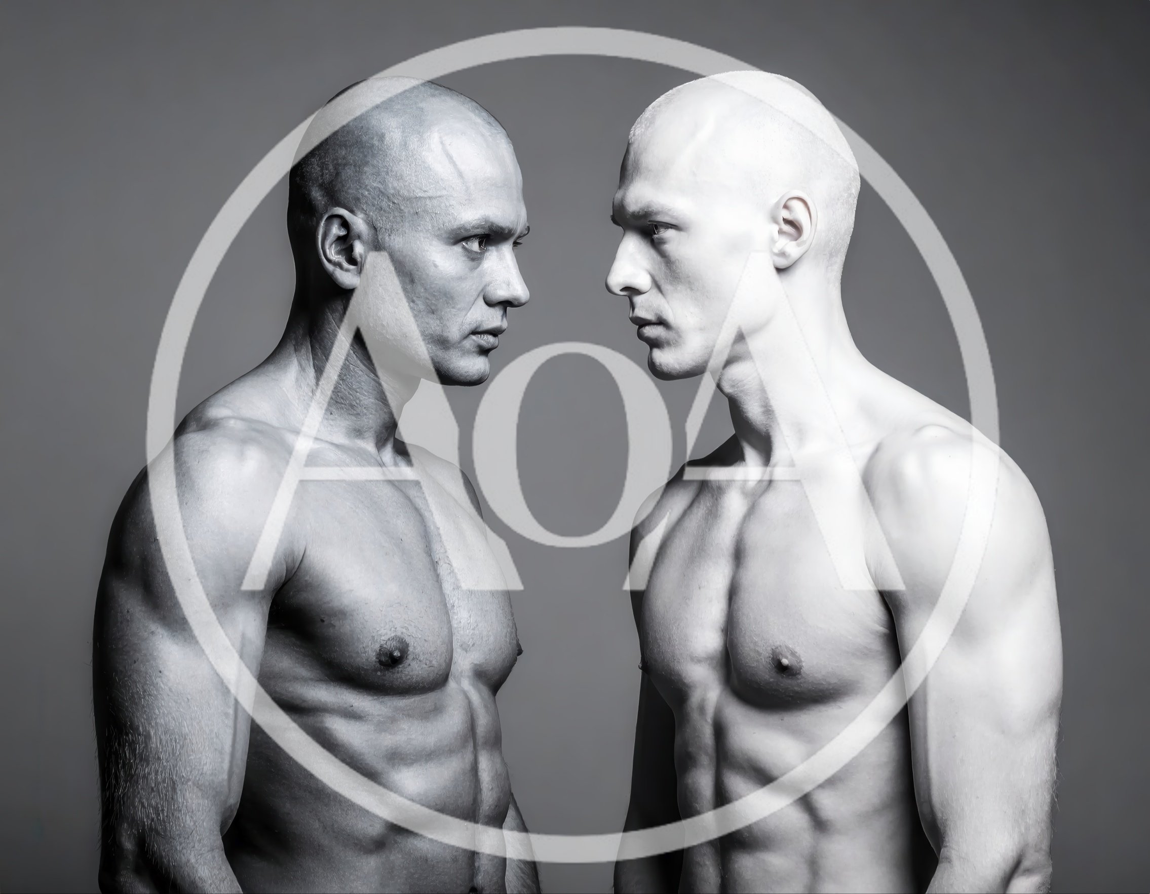 Two Muscular Men Facing Each Other In Studio