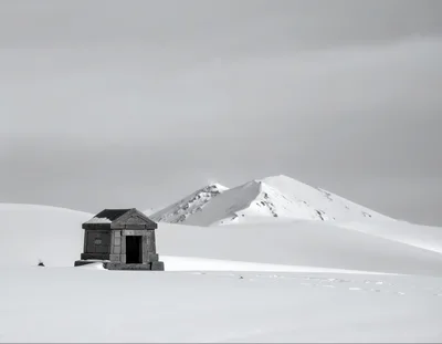 Small Stone Structure In A Snowy Mountain Landscape