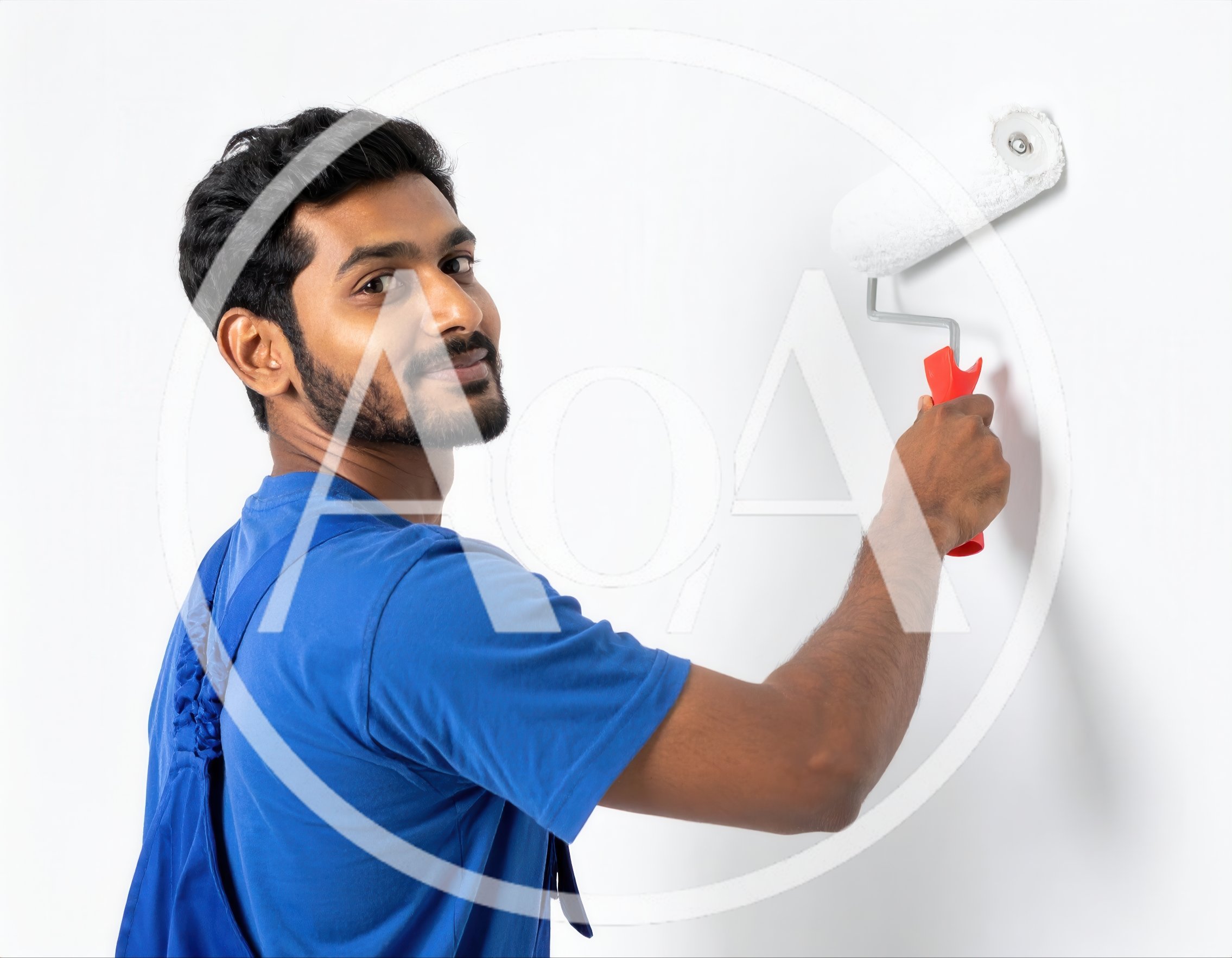 Young Man Painting A White Wall With A Roller