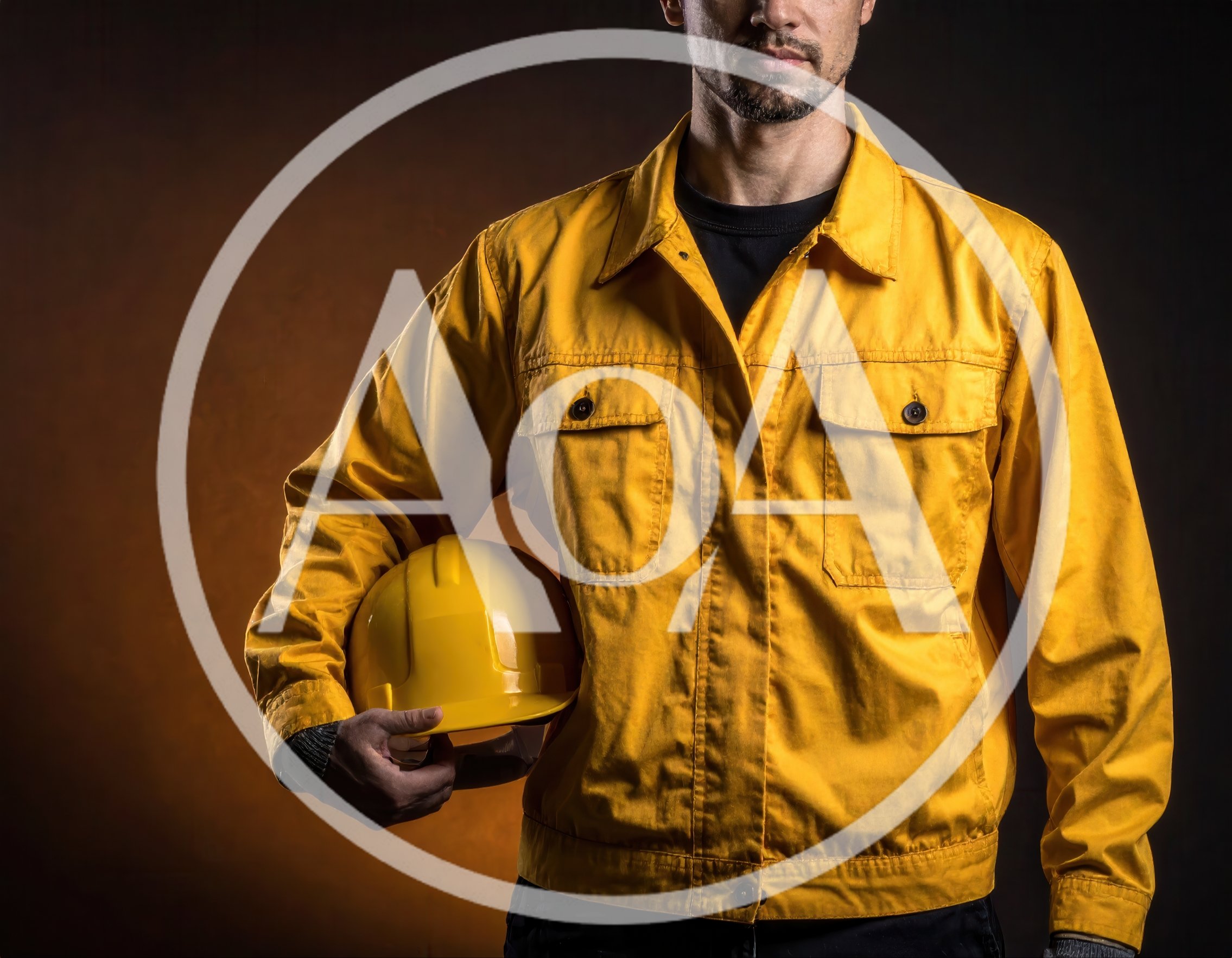 Construction Worker Holding Yellow Hard Hat