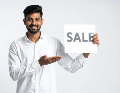Young Indian Man Holding Sale Sign