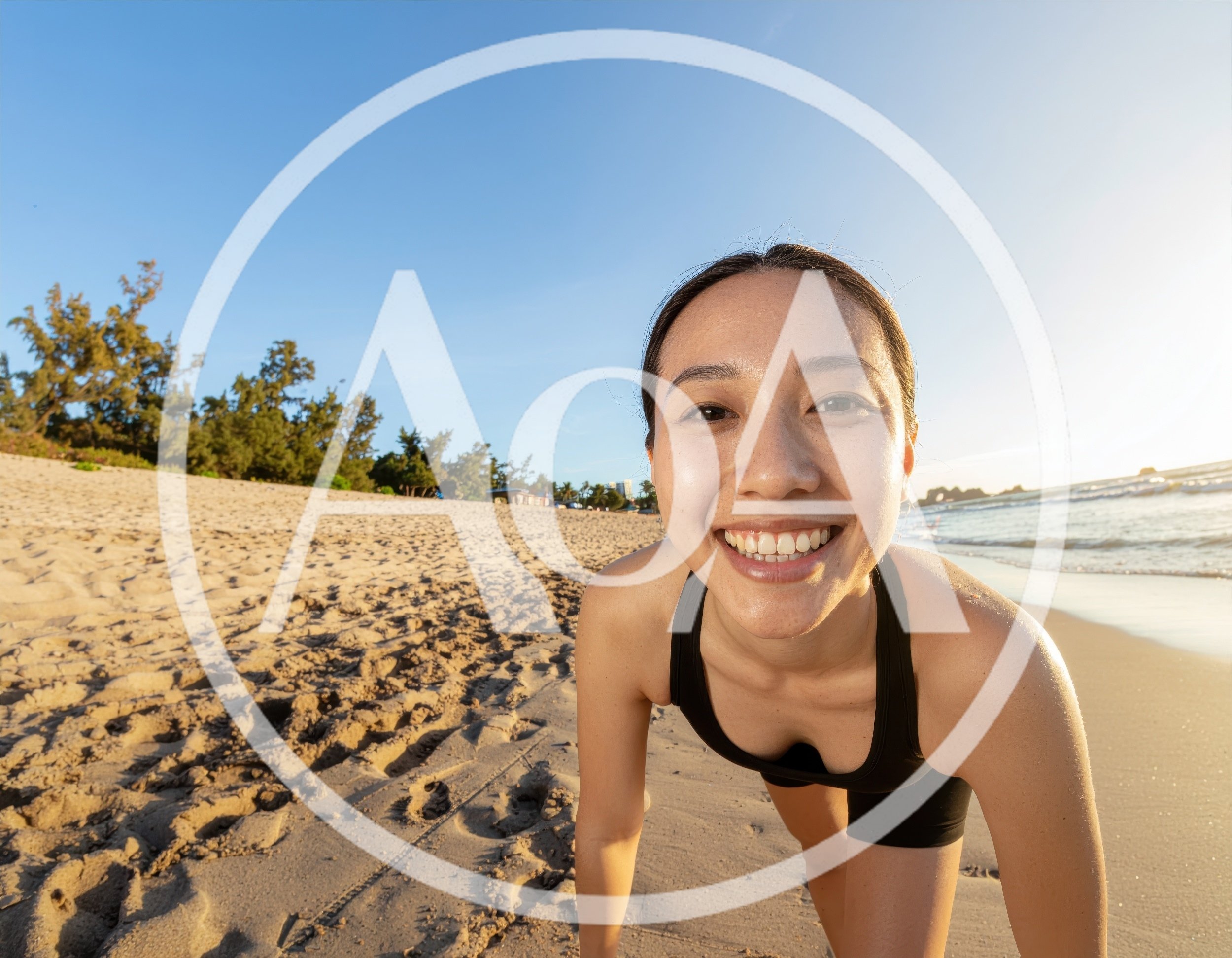Young Woman Doing Pushups On A Sunny Beach