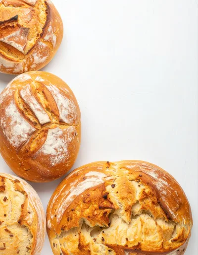 Freshly Baked Artisan Bread Loaves On White Background