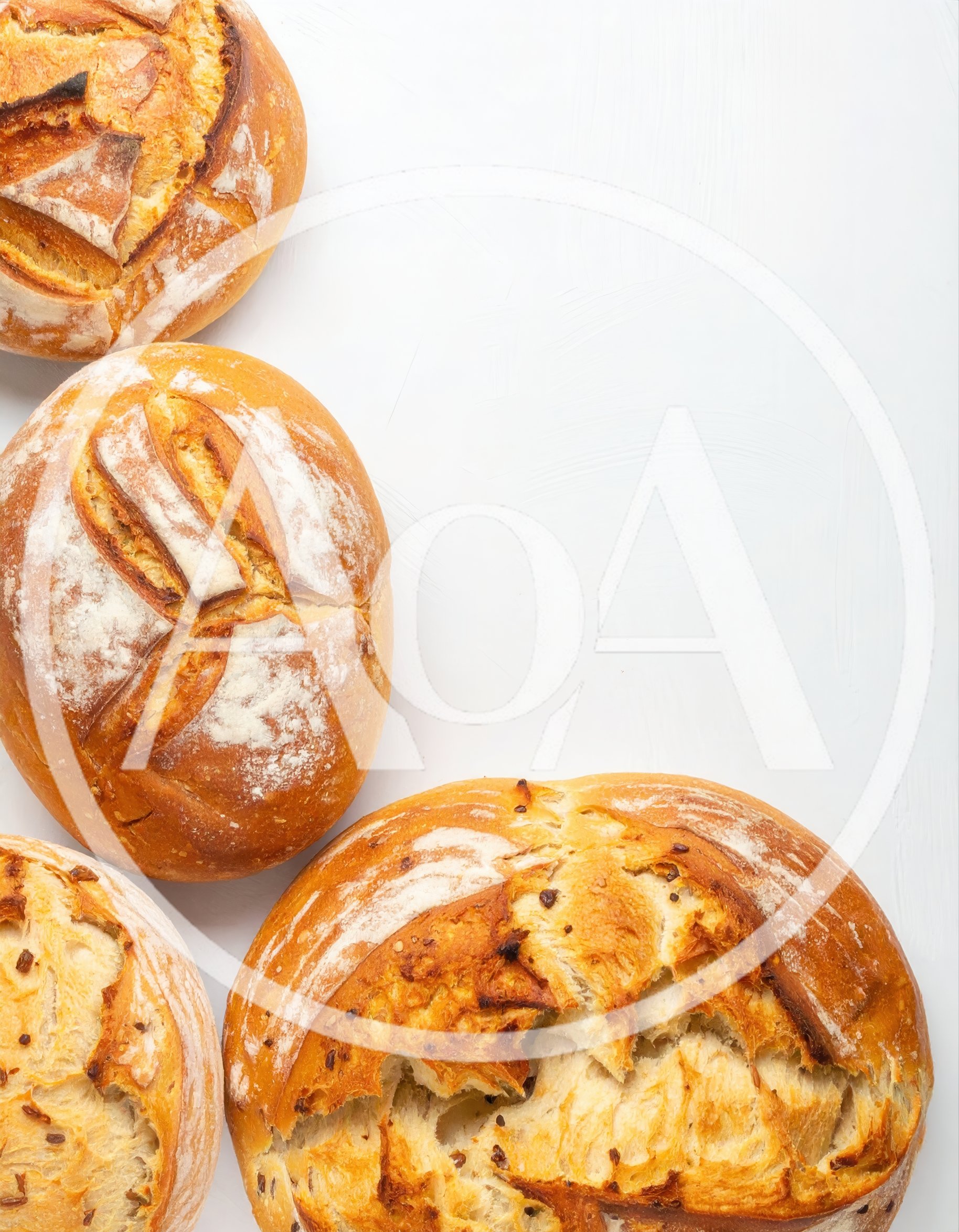 Freshly Baked Artisan Bread Loaves On White Background