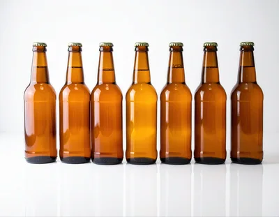 Seven Brown Glass Beer Bottles In A Row
