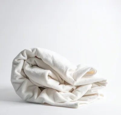 Folded White Fleece Blanket On White Background