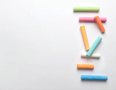 Colorful Sidewalk Chalk Sticks Arranged On White Background