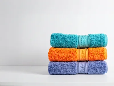 Stack of Three Colorful Folded Bath Towels
