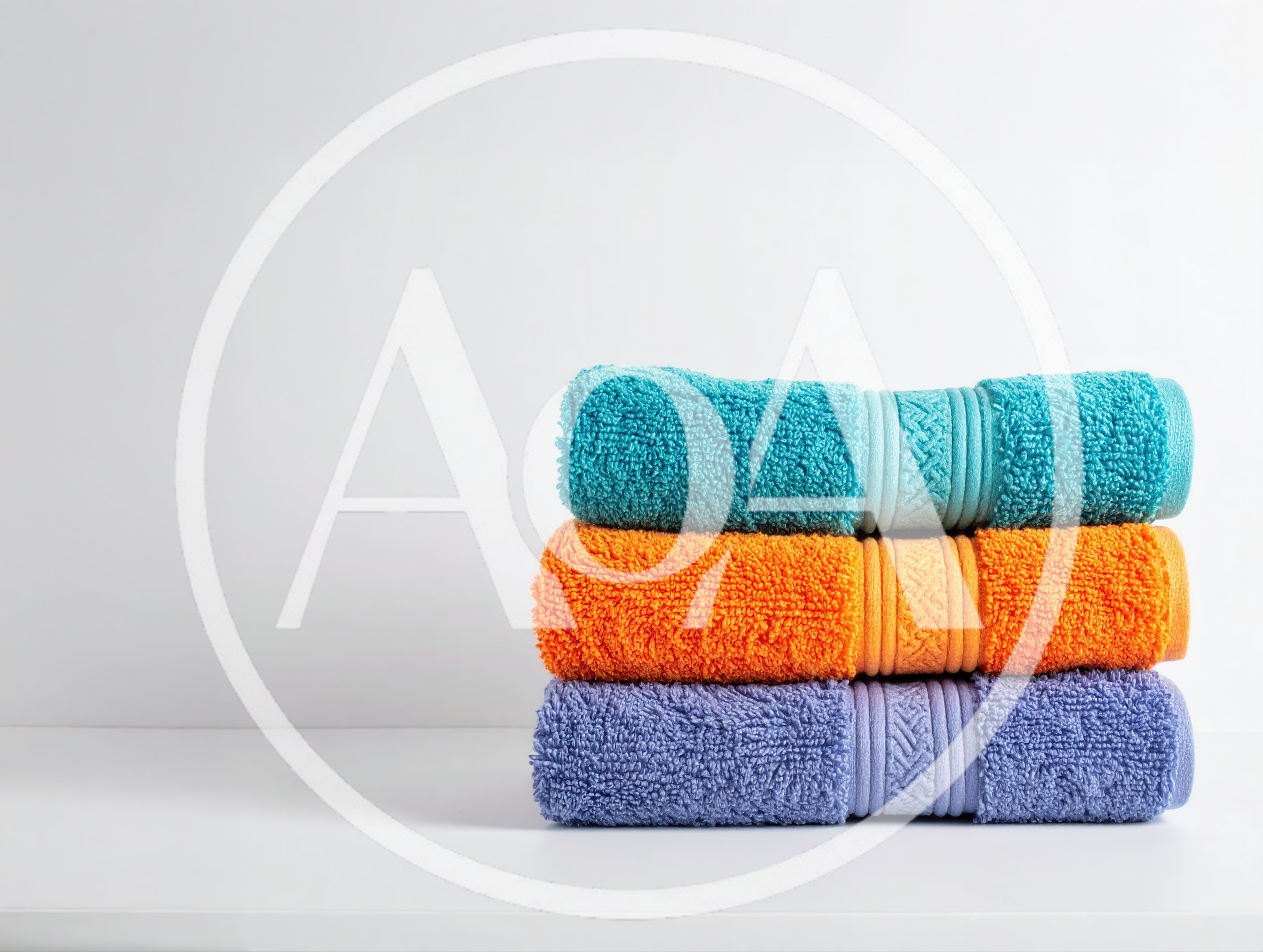 Stack of Three Colorful Folded Bath Towels