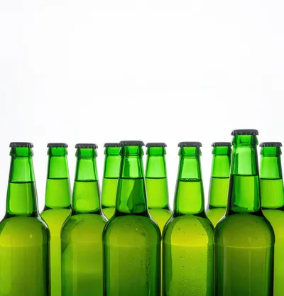 Row of Green Glass Beer Bottles
