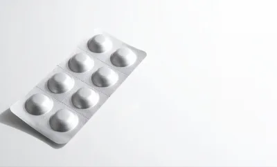 Blister Pack Of White Pills On White Background