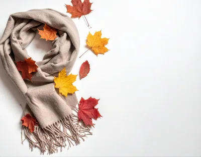 Beige Scarf With Autumn Leaves On White Background