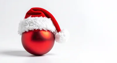 Red Christmas Ornament Wearing A Santa Hat