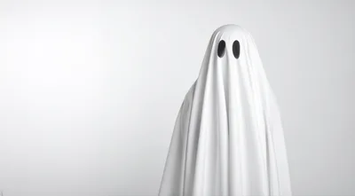 Person Dressed As A Classic White Sheet Ghost