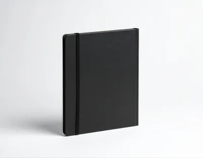 Black Notebook With Elastic Band On White Background