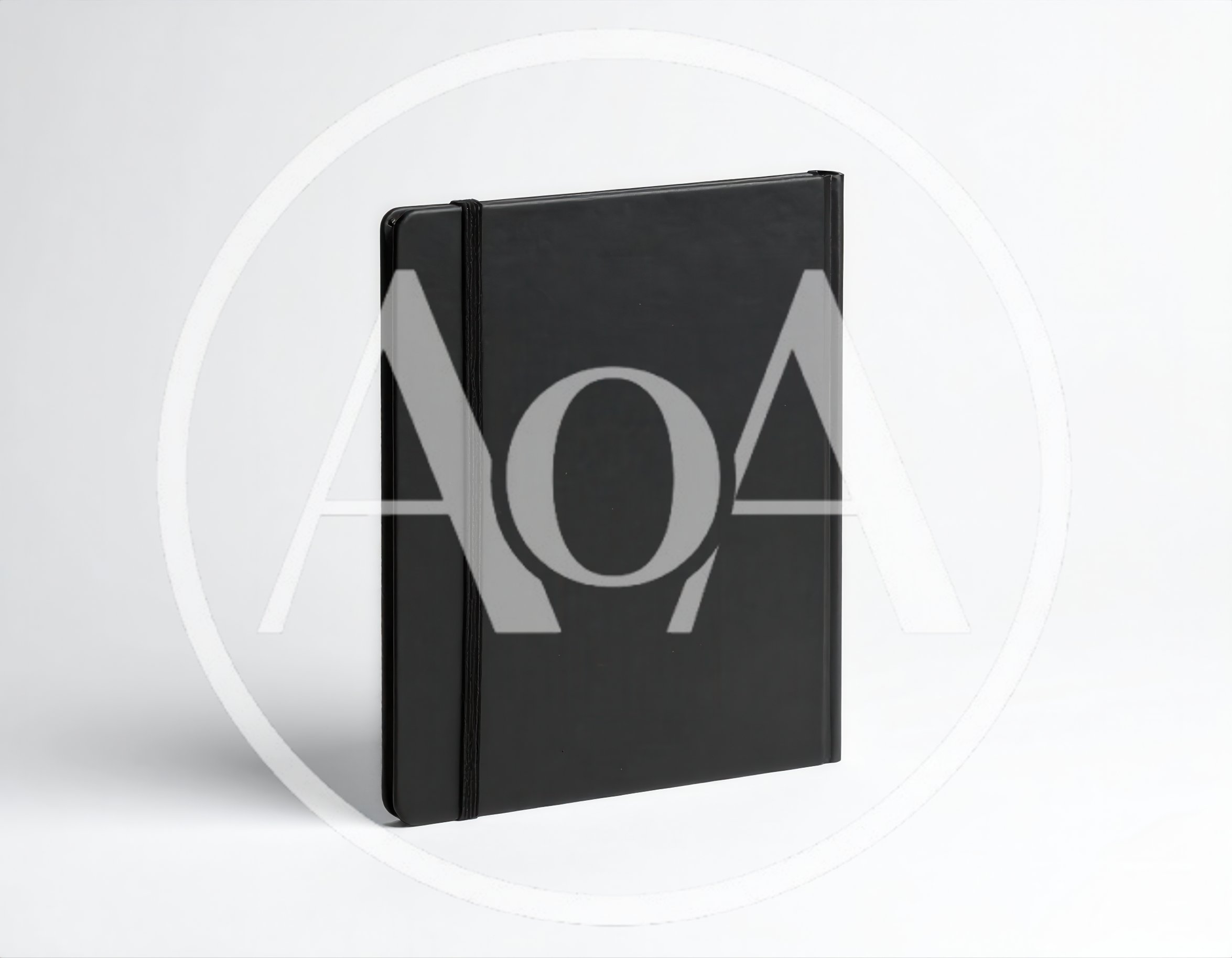 Black Notebook With Elastic Band On White Background
